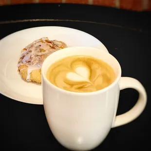 Oat milk latte and gluten free cinnamon roll.