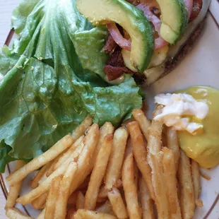 Bacon Swiss avocado burger with no bun, fries. The fries were coated in something that was probably wheat flour.