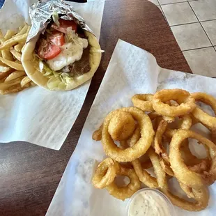 Gyro plate, fries, and side of onion rings from Milo&apos;s; delicious!