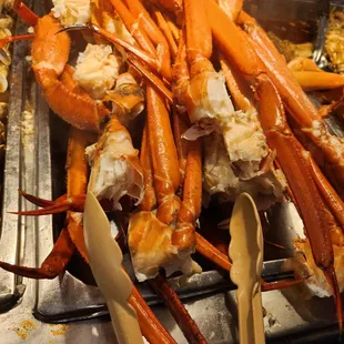 a large pile of crab legs