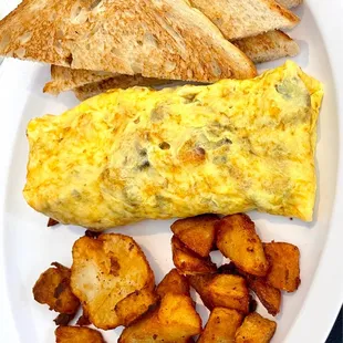 Mushroom and ham omelet, extra crispy home fries and toast