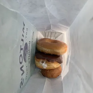 three doughnuts in a bag
