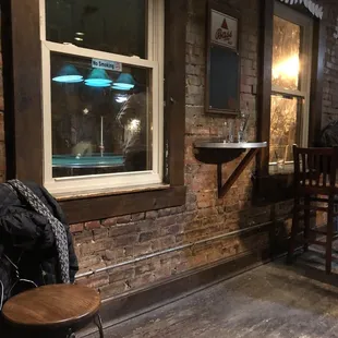 a bar with a brick wall