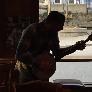 a man playing a banjo