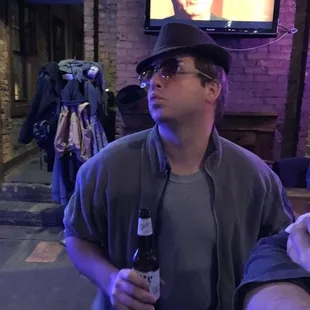 a man holding a beer