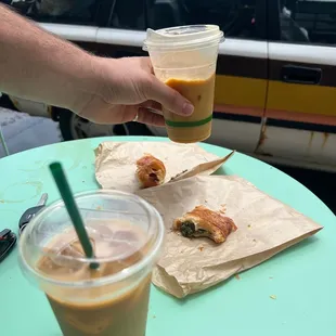 Cold brew, latte, spinach croissant and ham and cheese croissant