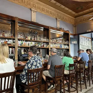 customers sitting at the bar