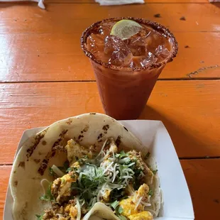 Breakfast burrito with chorizo, egg, cheese and cilantro. Bloody Mary with tequila