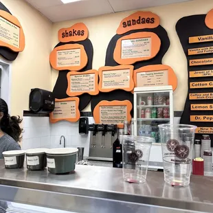 a woman behind the counter