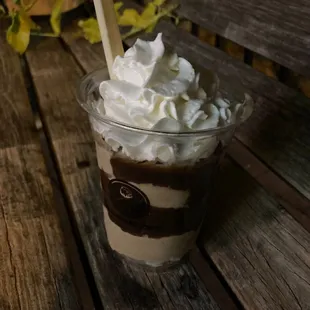 a cup of coffee with whipped cream