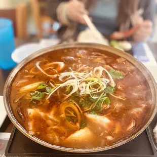 a bowl of soup on a stove