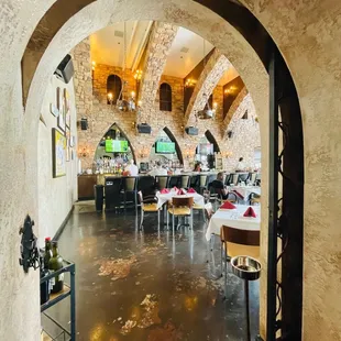 view of a restaurant through an archway