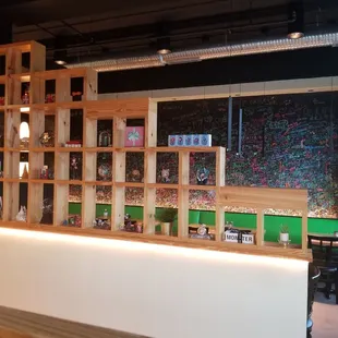 Entrance to the right features a fun graffiti wall, complete with neon markers to add your own 2 cents. Go make your mark!