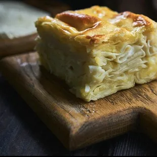 Khachapuri ACHMA is a Georgian dish consisting of a few layers of tender dough, a crispy top, and lots of cheese in between.