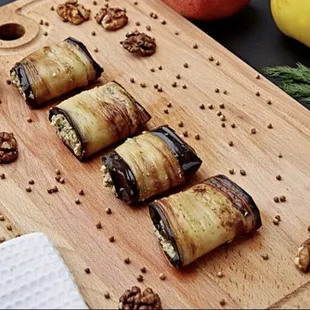 fried eggplant stuffed with spiced walnut and garlic paste. It is often topped with pomegranate seeds.
