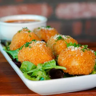 Golden balls of cheesy risotto.