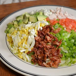 This Cobb's got it all! 
Loaded with diced avocado, crunchy bacon, bleu cheese, turkey, green onion, tomato, &amp; hard-boiled egg!