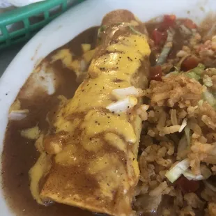 a plate of enchiladas and rice