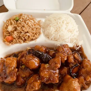 a chicken dish with rice and carrots