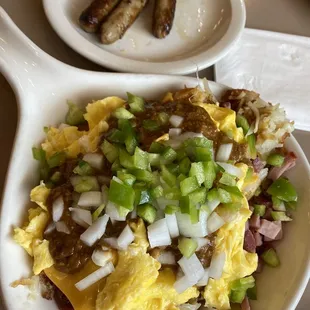 an omelet with sausages and eggs