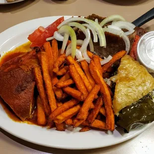Greek Trio (Grape Leaf, Moussaka and Spinach Pie) with Gyro Meat and Sweet Potato Fries at Mimi's Diner
