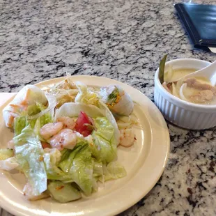 Shrimp salad, spicy green papaya salad, spring rolls, coconut soup