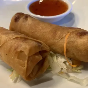 Plate with an order of 2 spring rolls and a dish of sweet spicy chili sauce. 3. Fresh Spring Rolls