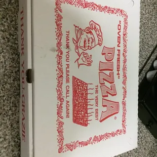 a pizza box on the floor