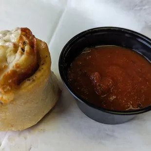 Garlic knot and sauce for dipping