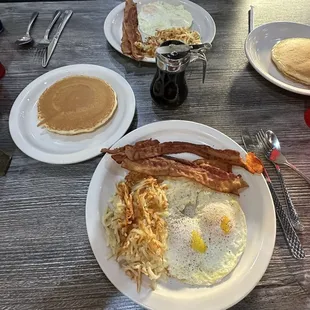 2 eggs over easy, hash browns, extra crispy bacon (4 pieces!) and 2 pancakes served with warm syrup. So much food!