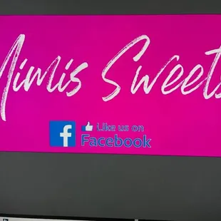 a computer screen with a pink background