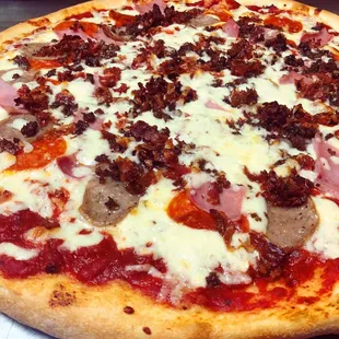a pizza with meat and cheese
