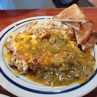 Mom's Denver omelet with hash brown's, wheat toast and super delicious Colorado green chili.