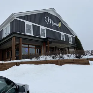 a car parked in front of a restaurant