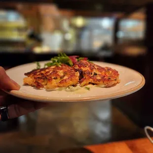 a person holding a plate of food