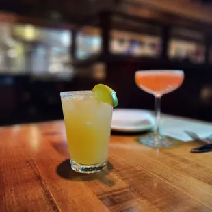 two cocktails on a table