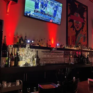a bar with red lighting