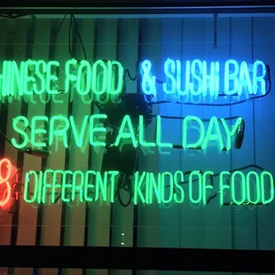 a neon sign for chinese food and sushi bar