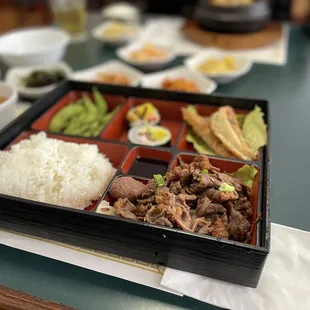 a bento box of food