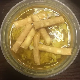 Egg drop soup with the fried noodles in the soup.