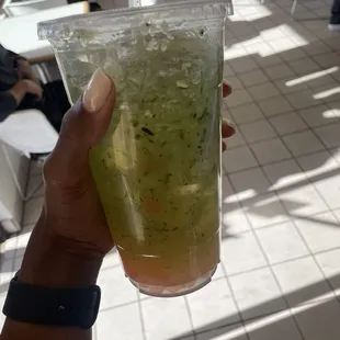 Cucumber lemonade with strawberry popping boba