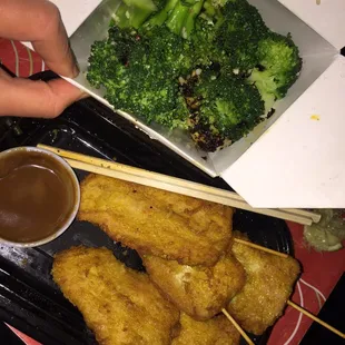 Chicken Satay, side of garlic stir fry broccoli