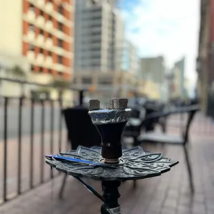 a table and chairs on a sidewalk