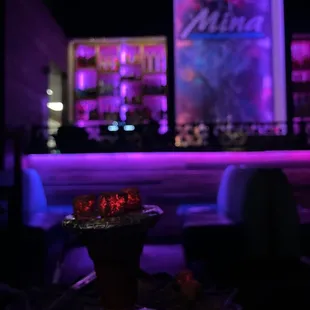 a bowl of food on a table in front of a bar