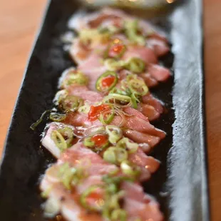 a close up of a plate of sushi