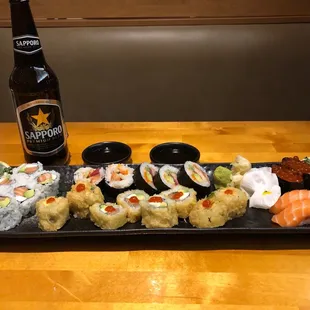 L to R: Philadelphia maki, Crazy maki (top), Las Vegas maki (bottom), ikura (salmon roe) nigiri, and salmon nigiri