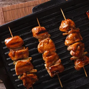 chicken skewers on a grill