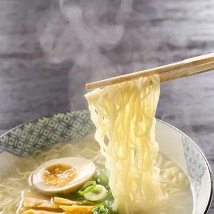 a bowl of ramen and chopsticks