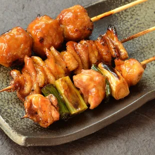 skewered chicken and vegetables on a plate