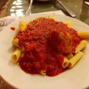a plate of pasta and meatballs